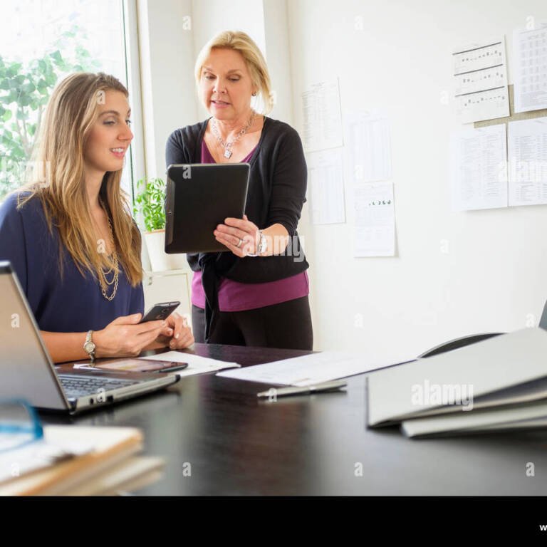 two-business-women-talking-in-office-EXX210